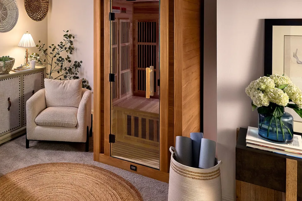Sauna interior with electric heater and cedar benches