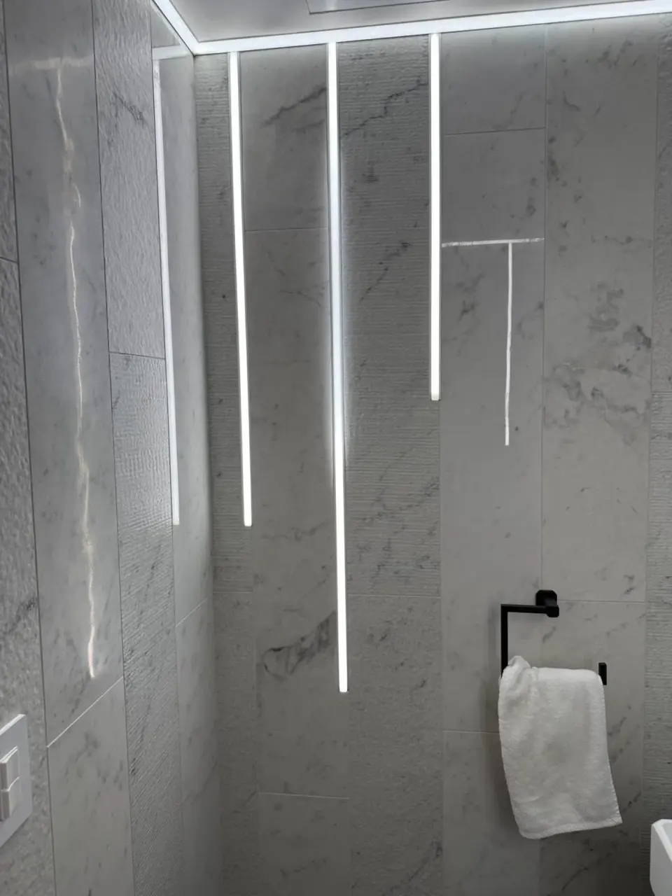 Marble walk-in shower in a renovated Bergen County bathroom